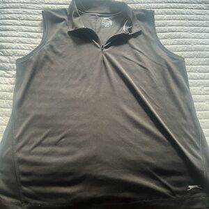 Black,sleeveless women’s golf/tennis shirt.